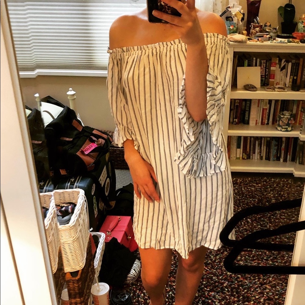 Light seaside summer dress with exposed shoulder.